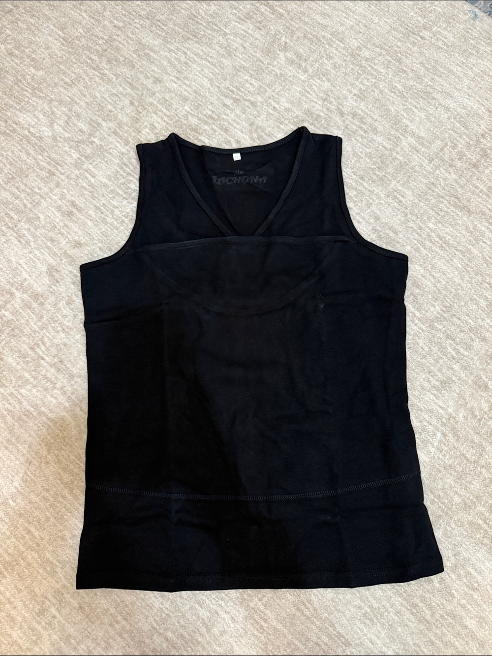 Baby holding shirt